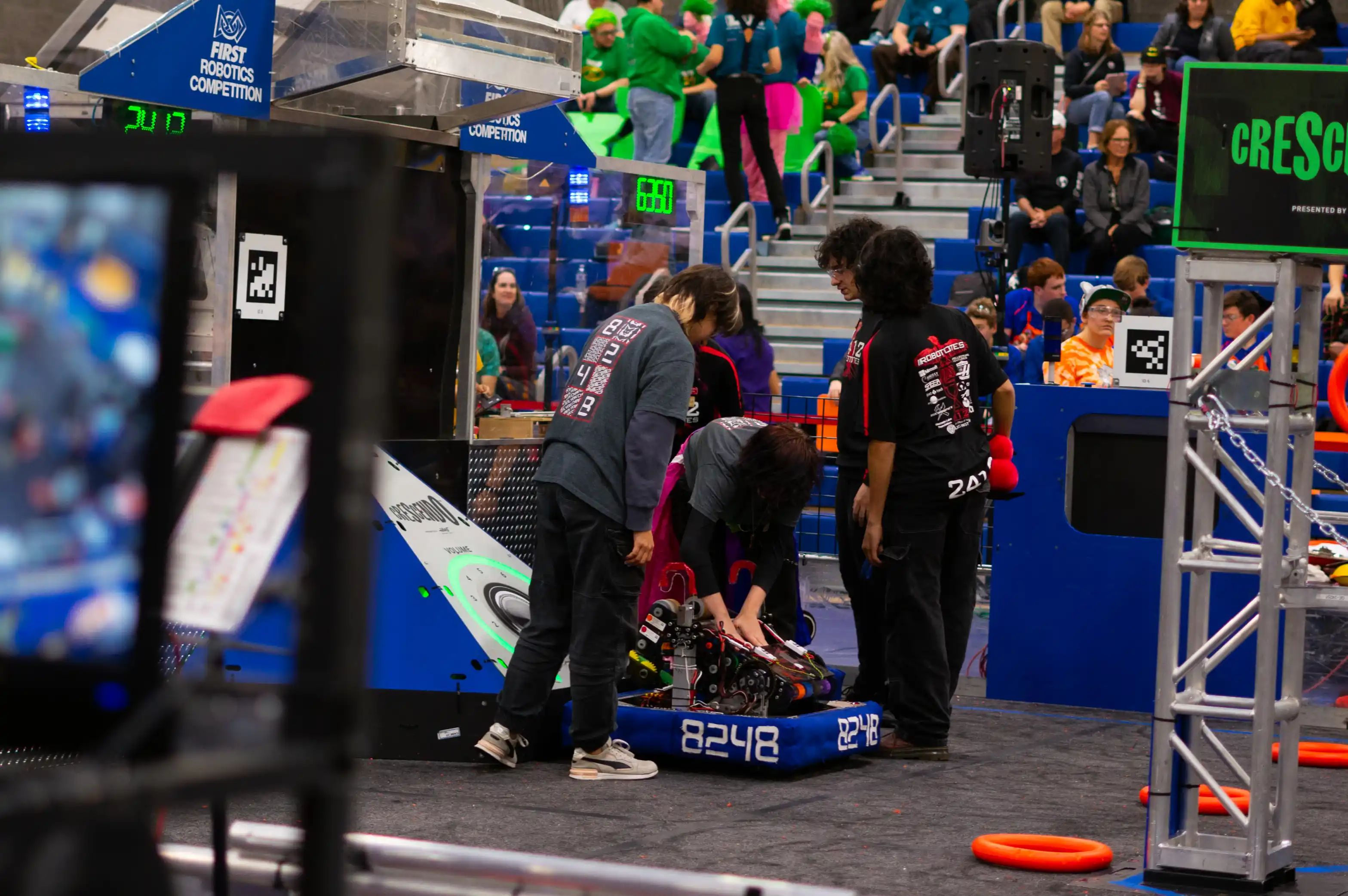 Loading the robot onto the field at the 2024 Girls Gen competition